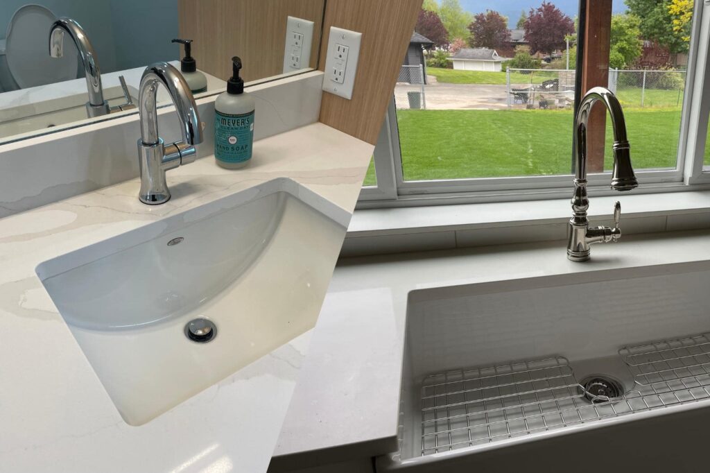 Modern bathroom and kitchen faucets repaired by Kingdom Plumbing & Heating in Chilliwack, showcasing sleek chrome fixtures and expertly installed sinks.